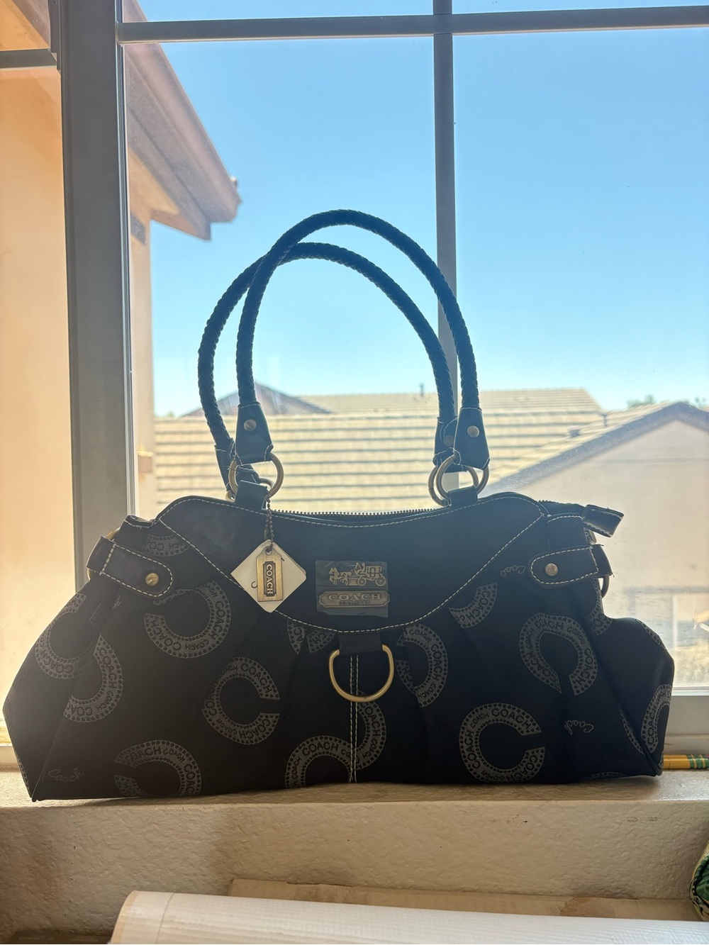 Coach Dotted Op Art Sophia handbag in black and gray.